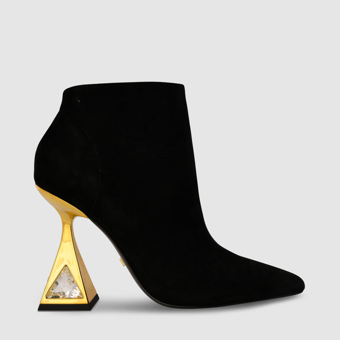 Outer side view of the kat maconie sofi boots in black/gold.