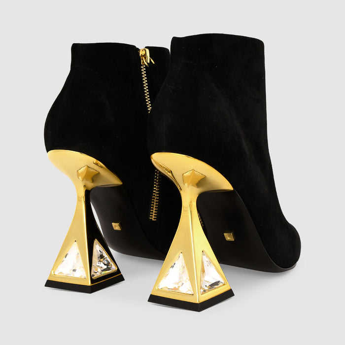 back view of the kat maconie sofi boots in black/gold.