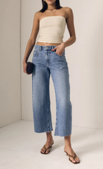 Load image into Gallery viewer, Woman wearing a strapless top and wide-leg jeans against a plain background
