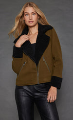 Load image into Gallery viewer, Front top half view of a woman wearing the Lisa Todd No Limits Jacket in the color olive with black sherling trim.
