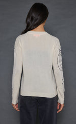 Load image into Gallery viewer, Back top half view of a woman wearing the lisa todd the messenger sweater in the color frosting (white).
