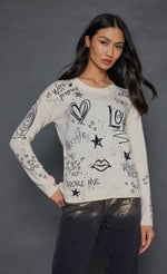 Load image into Gallery viewer, Front top half view of a woman wearing the lisa todd the messenger sweater in the color frosting (white).
