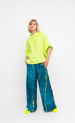 Load image into Gallery viewer, Front full body view of a woman wearing the ozai n ku ocean breeze pants.
