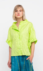 Load image into Gallery viewer, Front top half view of a woman wearing the ozai n ku lime crinkle funnel shirt.
