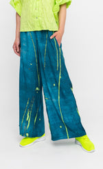 Load image into Gallery viewer, Front full body close up view of a woman wearing the ozai n ku ocean breeze pants.
