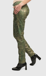 Load image into Gallery viewer, Left side bottom half view of a woman wearing the Alembika Green Iconic Jeans Desires
