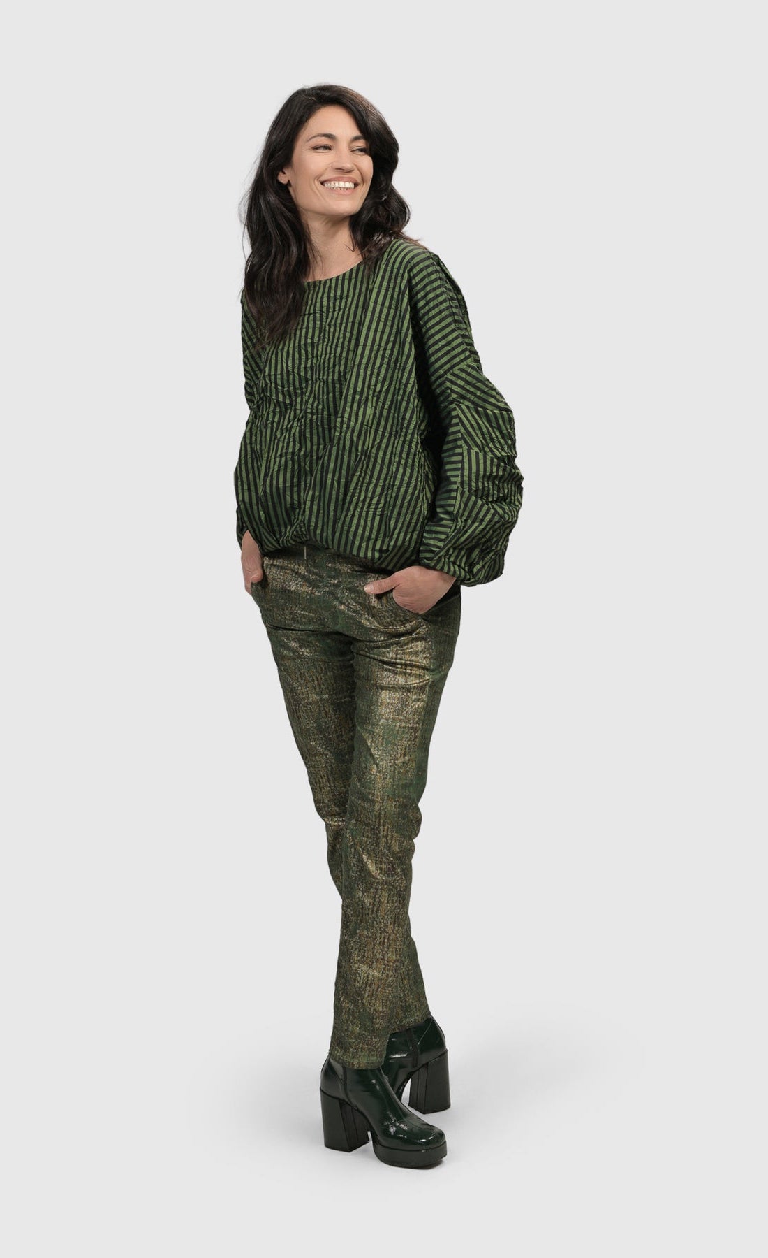 Front full body view of a woman wearing the Alembika Green Iconic Jeans Desires