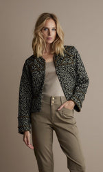 Load image into Gallery viewer, Front top half view of a woman wearing the summum lightly quilted jacket.

