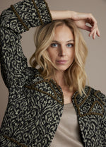 Load image into Gallery viewer, Front close up view of a woman wearing the summum lightly quilted jacket.
