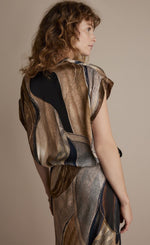 Load image into Gallery viewer, Back top half view of a woman wearing the summum flowy lines sleeveless organic print top
