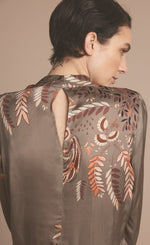 Load image into Gallery viewer, Back close up view of a woman wearing the summum leaves top with long puff sleeves.
