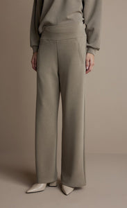 Front bottom-half view of a woman wearing the Summum Clay Scuba Wide-Leg Sweatpant