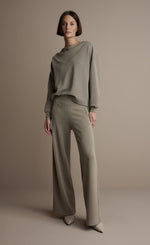 Load image into Gallery viewer, Front full body view of a woman wearing the Summum Clay Scuba Wide-Leg Sweatpant
