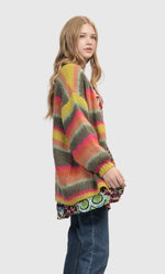 Load image into Gallery viewer, Right side top half view of a woman wearing the Alembika Stripes Sweater
