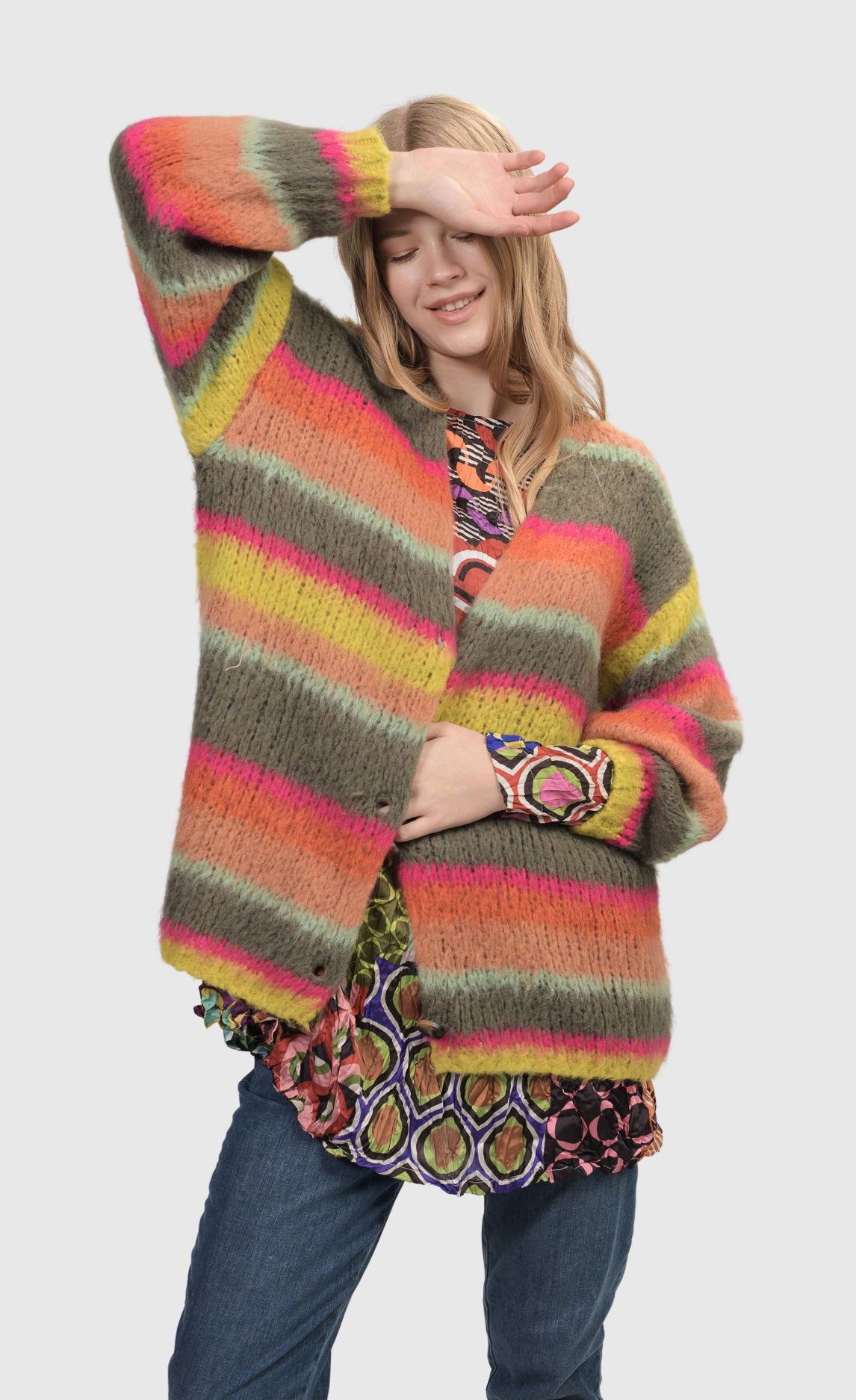 Front top half view of a woman wearing the Alembika Stripes Sweater