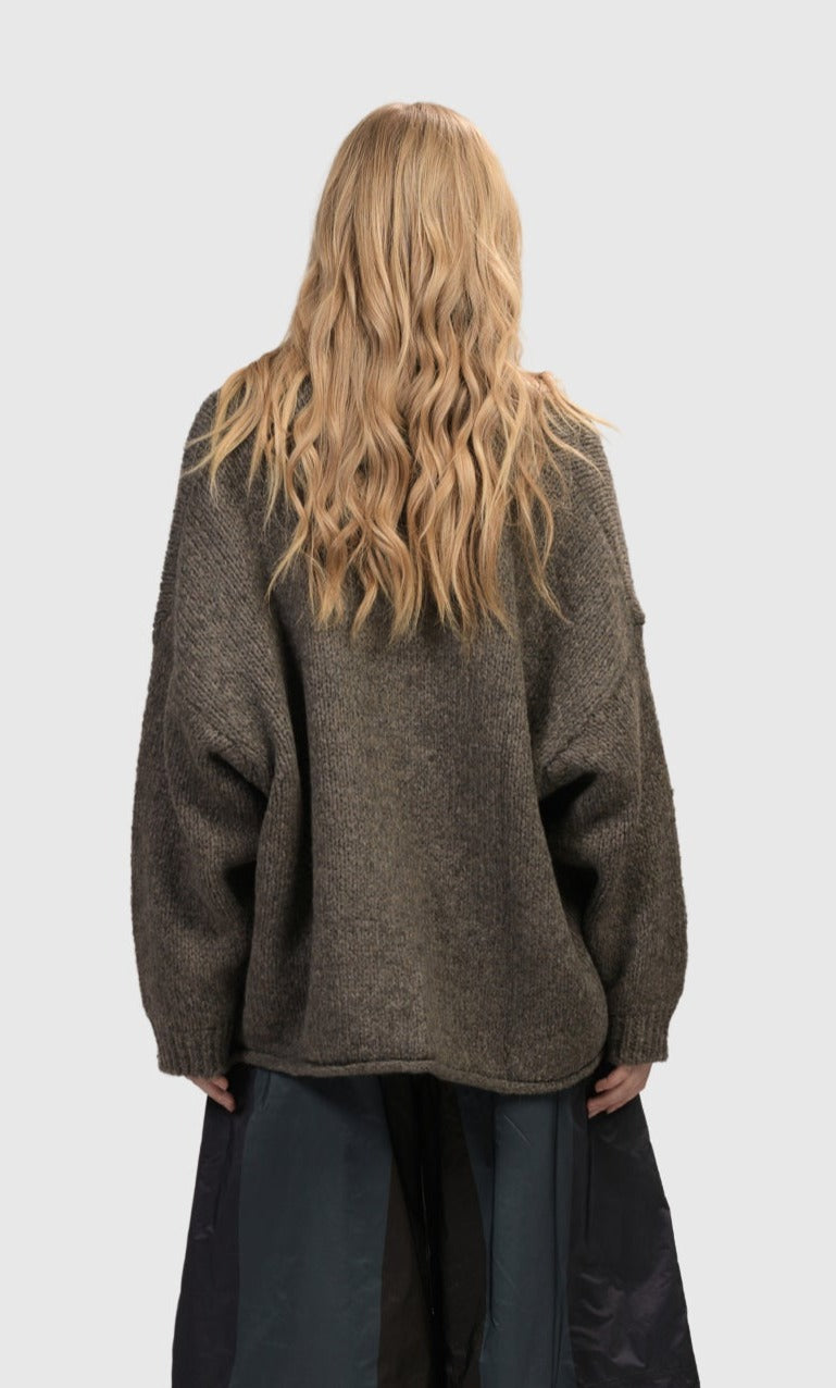 Back top half view of a woman wearing the alembika Taupe Sylvia Crop Cardigan