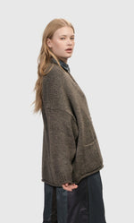 Load image into Gallery viewer, Right side top half view of a woman wearing the alembika Taupe Sylvia Crop Cardigan
