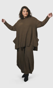 Front full body view of a woman wearing the Alembika Essential Trapeze Brown Top