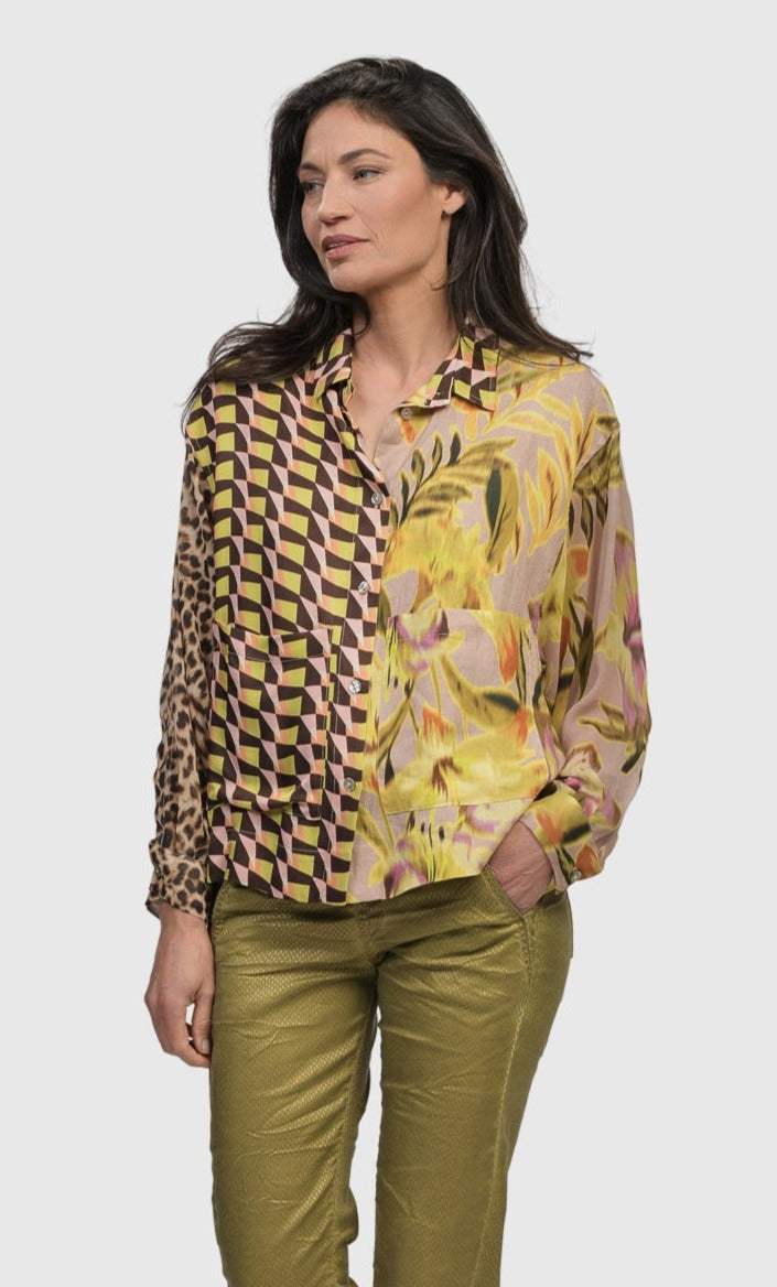 Front top half view of a woman wearing the alembika mix button down shirt 