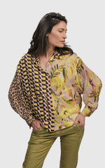 Load image into Gallery viewer, Front top half view of a woman wearing the alembika mix button down shirt 
