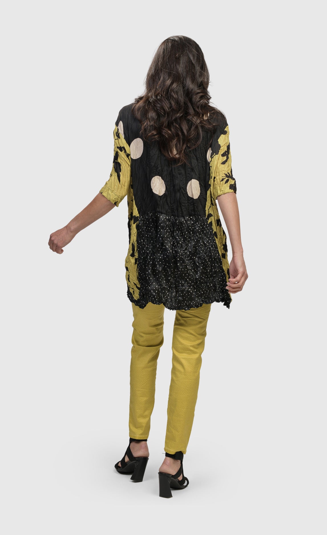 Back full body view of a woman wearing the alembika mix crinkle tunic.