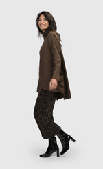 Load image into Gallery viewer, Left side full body view of a woman wearing the alembika Dynamite Days Straight Leg Pants in coffee.
