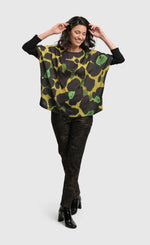 Load image into Gallery viewer, Front full body view of a woman wearing the Alembika Olive Martini Emerald Boxy Tee
