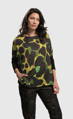 Load image into Gallery viewer, Front top half view of a woman wearing the Alembika Olive Martini Emerald Boxy Tee
