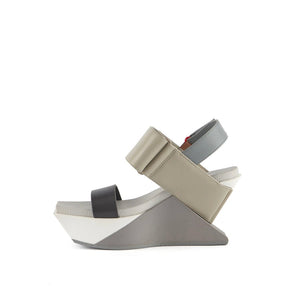 inner side view of the united nude delta wedge sandals in neutral.
