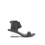 Load image into Gallery viewer, Outer side view of a woman wearing the united nude raila mid in black.
