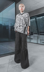 Load image into Gallery viewer, Front full body view of a woman wearing the xenia bobi shirt.
