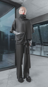 Front full body view of a woman wearing the xenia pozi top in grey/black