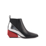 Load image into Gallery viewer, A black leather ankle boot with a chunky geometric block heel, featuring a metallic silver side panel and a bright red heel accent, shown against a plain white background.
