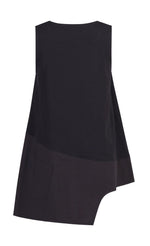 Load image into Gallery viewer, Back view of the Alembika black cotton asymmetrical tank. This sleeveless tank has a stepped hem with two different black fabrics. The back has a tiny pocket on the left side.
