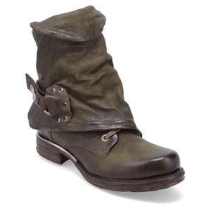 Outer front side view of the emerson boot in jungle (olive). This boot has a lace up front with a leather overlay that's secured with a buckle.