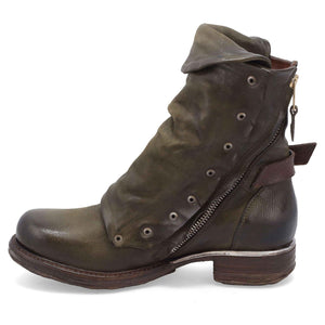 Inner side view of the emerson boot in jungle (olive). This boot has a lace up front with a leather overlay that's secured with a buckle. The inner side has zipper that reaches to the back.