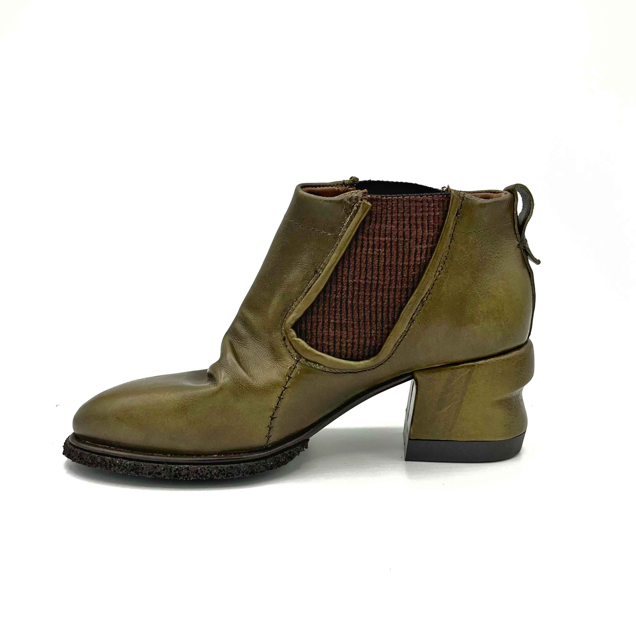 Inner side view of the A.S.98 Lavern Chelsea Boot in jungle. This boot is olive green with brown elastic gores on the side, a layered instep, and a grooved chunky heel.
