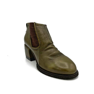 Outer front side view of the A.S.98 Lavern Chelsea Boot in jungle. This boot is olive green with brown elastic gores on the side, a layered instep, and a grooved chunky heel.