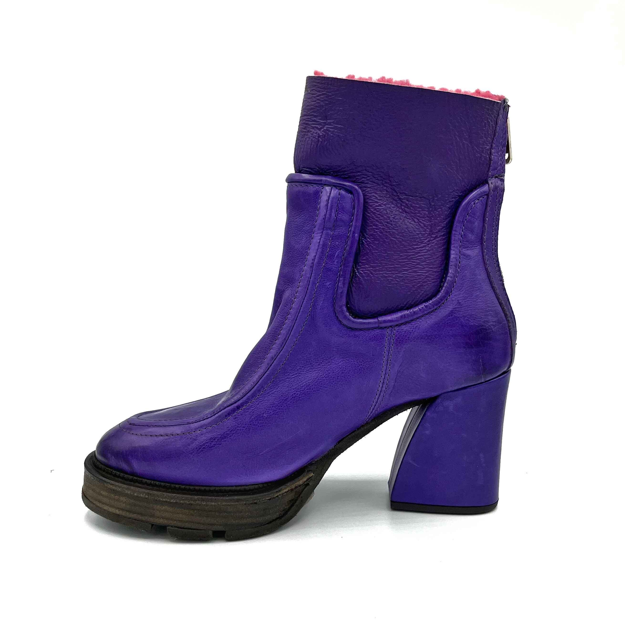 Inner side view of the A.S.98 Linkin Fur Boot in toxic. This boot is purple on the outside with pink sherpa lining. The boot has a high heel and almond toe.
