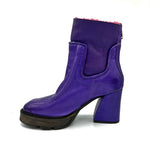 Load image into Gallery viewer, Inner side view of the A.S.98 Linkin Fur Boot in toxic. This boot is purple on the outside with pink sherpa lining. The boot has a high heel and almond toe.

