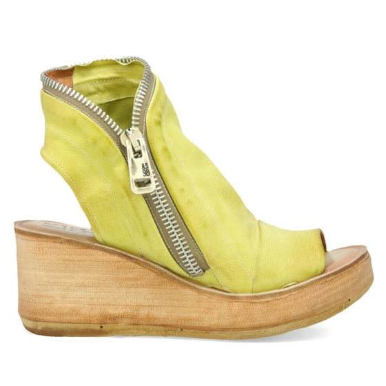 outer side view of the AS98 naylor wedge sandal in the color zen/yellow. this sandal has a wood-like wedge and leather overing the foot and ankle. The sandal has an open toe and heel and the outer side of the sandal has a zipper. 