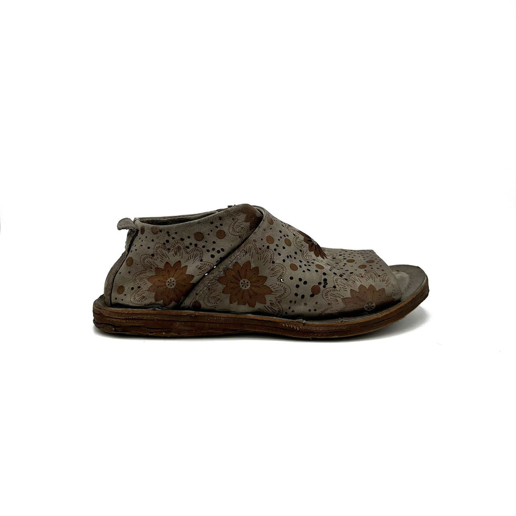 outer side view of the as98 ronald flat. This shoe is grey with an embossed, brown, floral pattern. the shoe has an open toe with the rest of the foot being covered by leather.