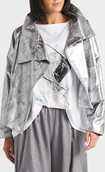Load image into Gallery viewer, Front view of a woman wearing the Planet cropped asymmetrical jacket in marble.
