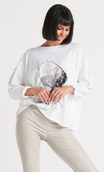 Load image into Gallery viewer, Front top half view of a model wearing the planet abstract luxury boxy tee.
