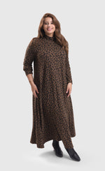 Load image into Gallery viewer, Front full body view of a woman wearing the alembika chiu swing dress. This dress is brown with black cheetah print. It has long sleeves and a turtleneck.
