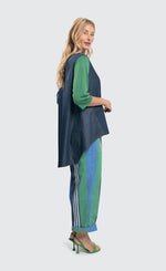 Load image into Gallery viewer, Right side full body view of a woman wearing the alembika denim top.
