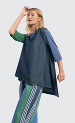 Load image into Gallery viewer, Front top half view of a woman wearing the alembika denim top.
