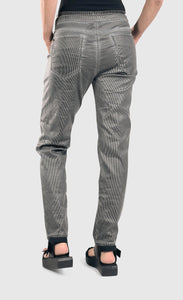 back bottom half view of a woman wearing the alembika iconic stretch jeans in a pinstripe black and white print. This pant has two back pockets, and a relaxed slim leg.