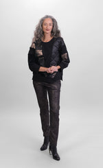 Load image into Gallery viewer, Front full body view of a woman wearing the alembika bronze top and the alembika  iconic stretch pant in the color sepia. The pant is dark brown/black with a small metallic-like animal print.
