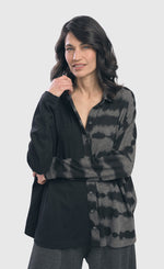 Load image into Gallery viewer, Front top half view of the Alembika Kai Tie Dye Button Up Shirt. This shirt is black striped on the right and black and grey tie dye on the left. The shirt has long sleeves, and a spread collar.
